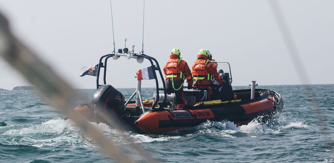 Two coatsguards in a boat at sea